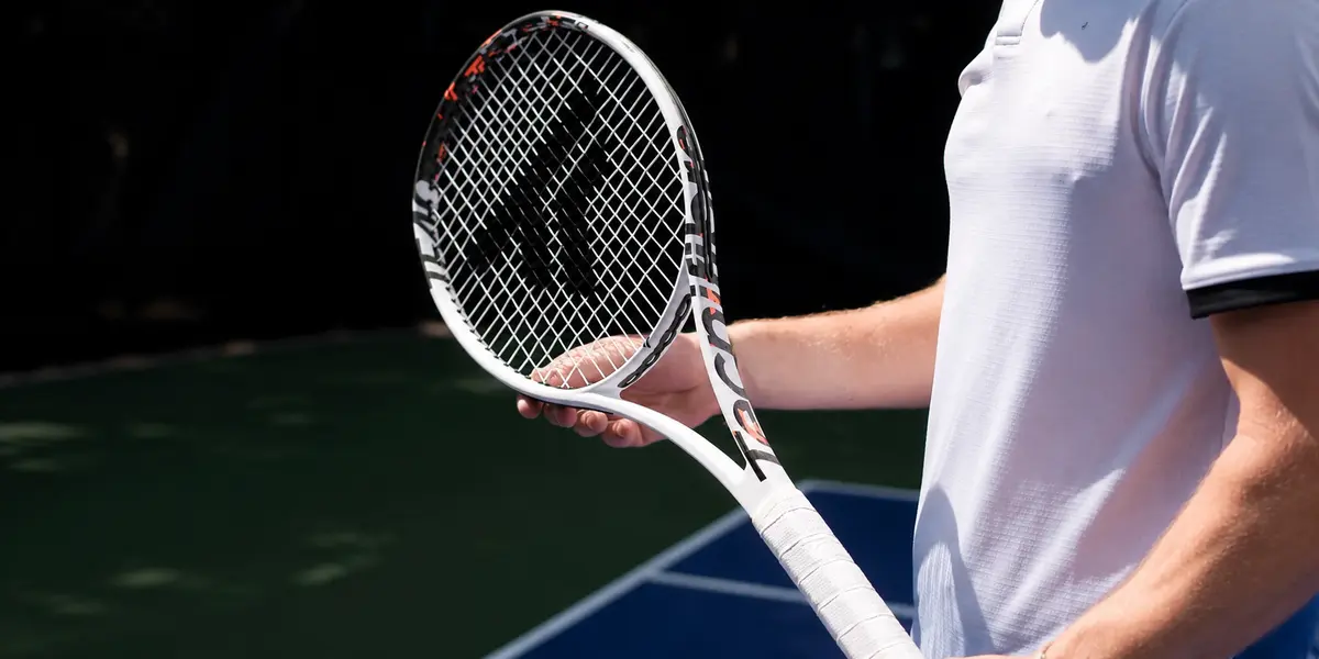 Player holding a Tecnifibre TF-40 racket on a hard court
